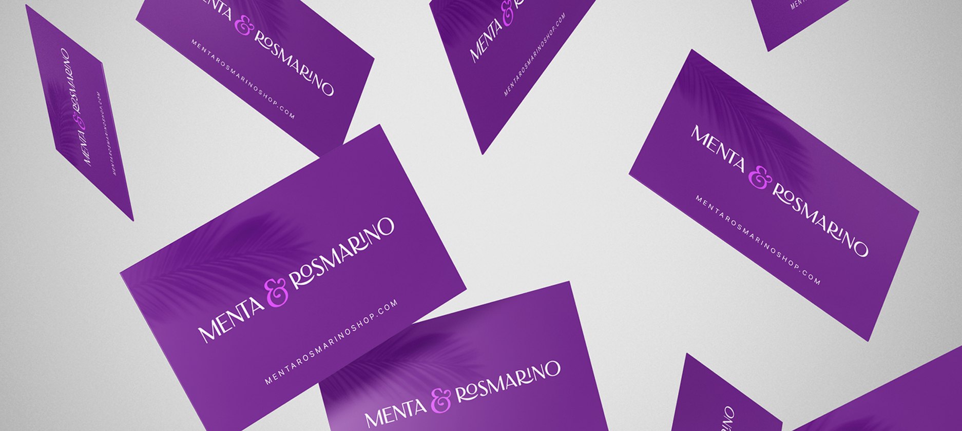 Biglietti da visita di Menta & Rosmarino con il logo bianco su fondo viola